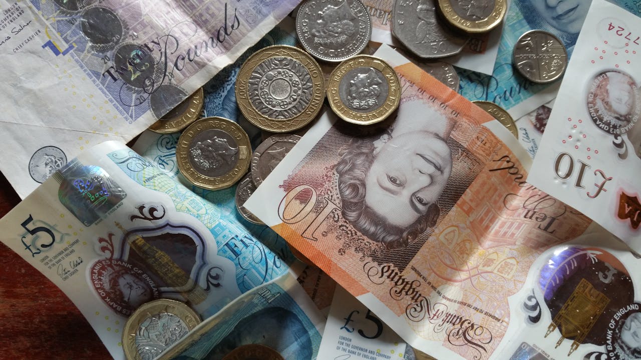 A pile of coins and banknotes