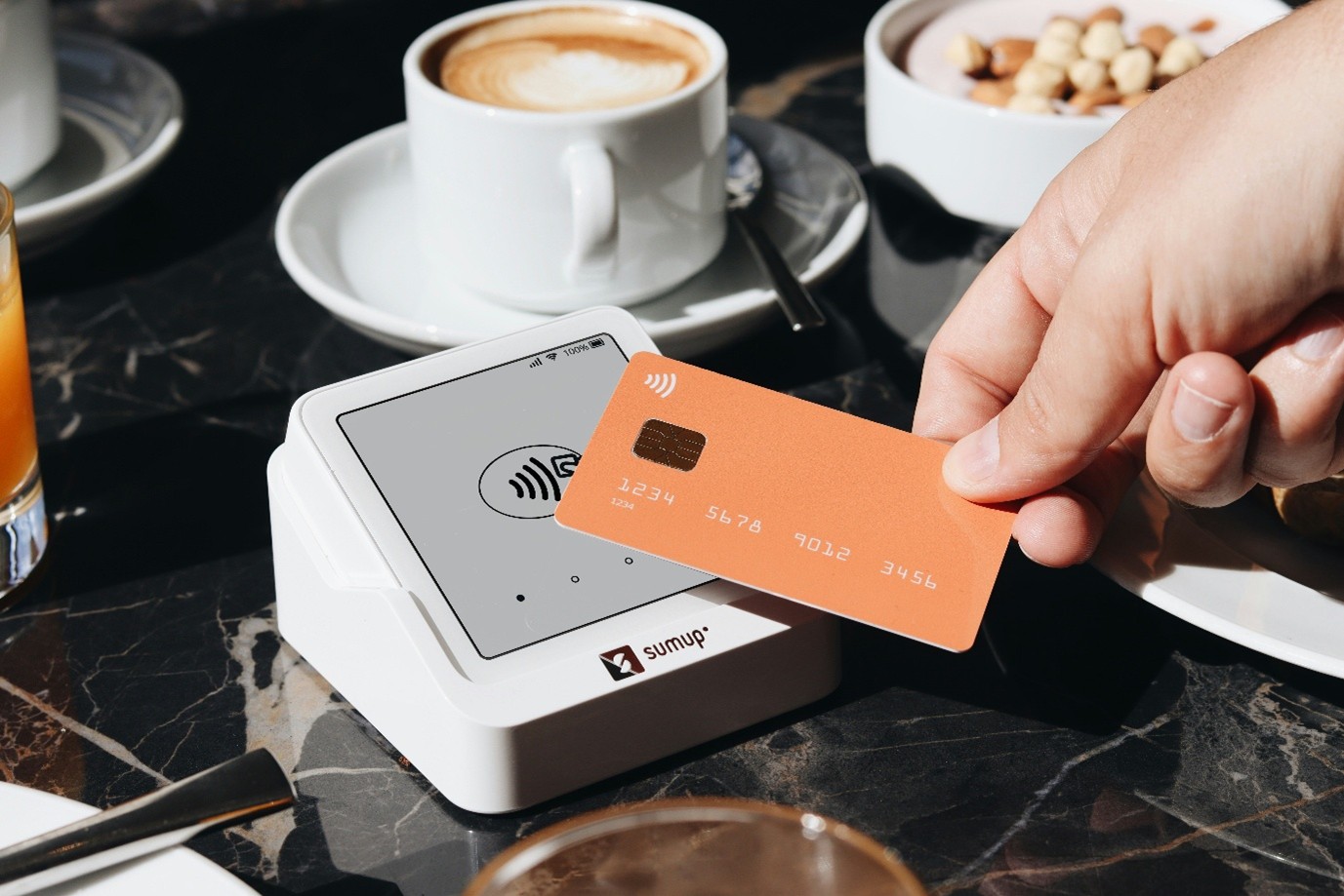 Person tapping bank card on card reader